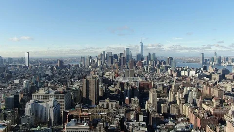 Downtown Manhattan skyline above dense rooftops and the Hudson Video stock 127046578