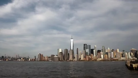 Downtown manhattan skyline with clouds moving over hudson river Stockbeeldmateriaal 337690211