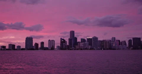 Downtown Miami from  Key Biscayne   bridge medium shot  purple haze sunset Stock Footage 241601856