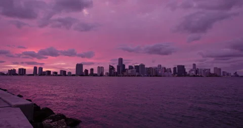 Downtown Miami from  Key Biscayne   bridge extreme wide purple haze sunset Stock Footage 241601930