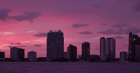 Downtown Miami from  Key Biscayne  close-up shot purple haze sunset Stock Footage 241601944