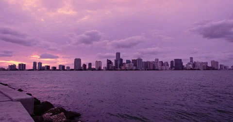 Downtown Miami from  Key Biscayne  extreme wide sunset purple haze lockoff Stock Footage 241601939