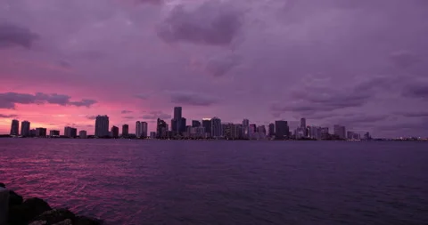 Downtown Miami from  Key Biscayne  slow pan extreme wide and medium purple h Stock Footage 241603276