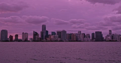 Downtown Miami from  Key Biscayne  sunset  purple haze  look 2 Stock Footage 241603294