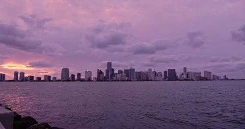 Downtown Miami from  Key Biscayne  sunset extreme wide slow pan purple haze Stock Footage 241610360