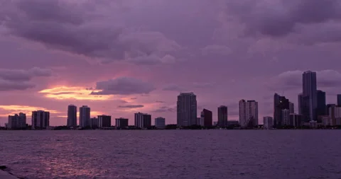 Downtown Miami from  Key Biscayne  sunset purple haze slow pan 3 Stock Footage 241610522