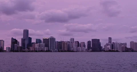 Downtown Miami from  Key Biscayne  sunset purple haze slow pan  and  lockoff Stock Footage 241610576
