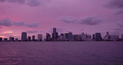 Downtown Miami from  Key Biscayne  wide sunset purple haze Stock Footage 241610939