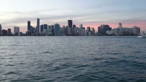 Downtown Miami seen from a boat navigating at the sunset Stock Footage 73444375