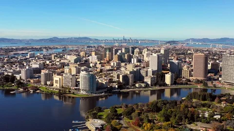Downtown Oakland Skyline Aerial Approach Over Lake Merrit w/ San Francisco  Stock Footage