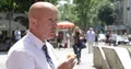 Downtown Sidewalk Image with Starved Businessman Eating Breakfast Meal 4k or 4k+ Resolution