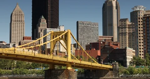 Downtown skyline and the Roberto Clemente Bridge in Pittsburgh Pennsylvania USA Stock Footage 118472353