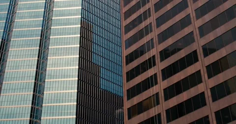 Downtown skyscraper extravaganza: breathtaking view from below focusing on Stock Footage 250235392