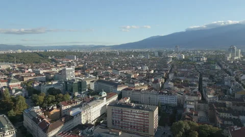 Downtown Sofia Bulgaria Drone Tracking Left Across Rooftops Mid Morning 4K Stock Footage 290367345