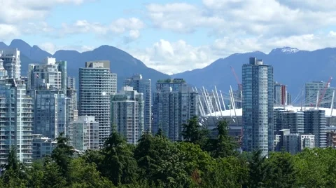 Downtown Vancouver with mountains at the background. Video stock 64283202