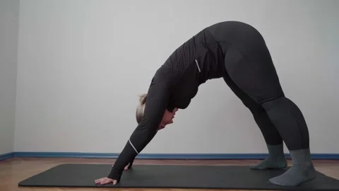 Downward Dog Stretch for Back Pain Relief and Full Body Flexibility Stock Footage 340545166