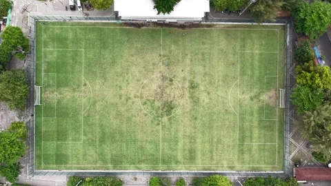 Downward-looking drone footage shows a mini soccer field playing ball. Located Stock Footage 316760068