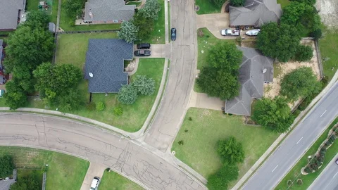 Downward looking slow flight over a residential street, Bryan, Texas Stock Footage 129204959