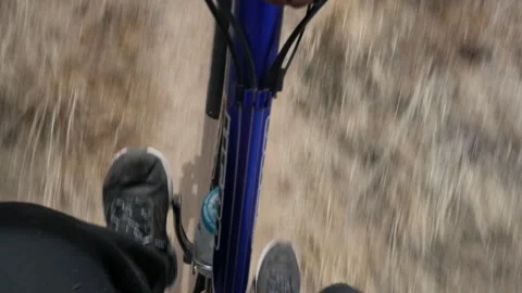 Downward mountain biking POV while riding on a trail Stock Footage 228784262