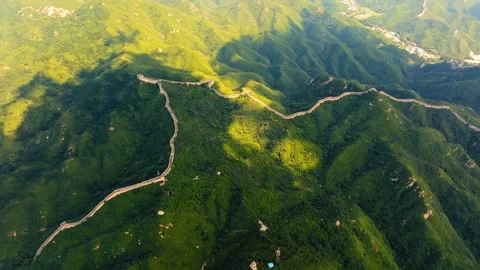 Downward mountain panorama with Great Wall lines in sun and shadow Stock Footage 346577295