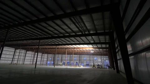 Downward Pan of Shadowed Empty Warehouse Stock-Footage 101390395