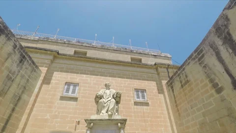 Downward Pan of Statue between Two Lions in Velletta, Malta Stock Footage 116451464