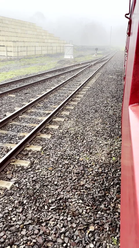 Downward side view out train window as it trundles along track Stock Footage 346508442