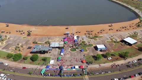 Downward tilted video above crowds at Carrera Rosa marathon ceremony Stock Footage 321805454