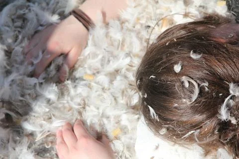 Downy feathers, hands &amp; hairs Фото
