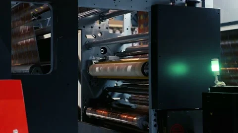 Doypack making packaging machine in modern factory with white rolls and Stock Footage 235908186