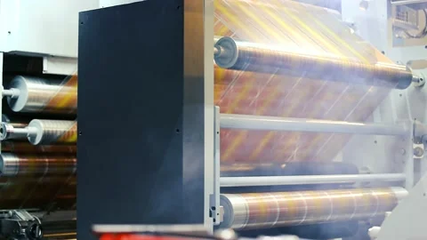 Doypack making packaging machine in modern factory with white rolls and Stock Footage 235910231