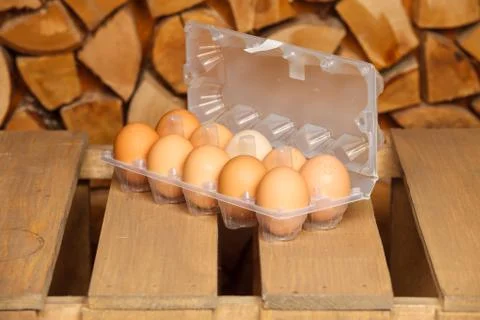 Dozen of brown eggs Stock Photos