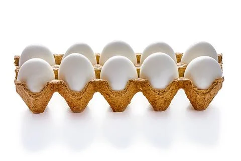A dozen eggs on a cardboard stand on a white isolated background Stock Illustration