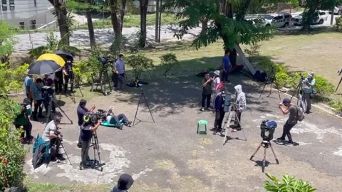 Dozen gather to view partial solar eclipse in Metro Manila, PHILIPPINES, PH - 20 Stock Footage 238982535