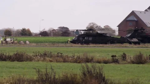 Dozens of Black Hawk and Apache helicopters in a field 1 Stock Footage 113297071