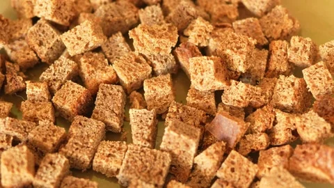 Dozens of small, rustic cubes of rye bread, like homemade croutons Stock Footage 329616266