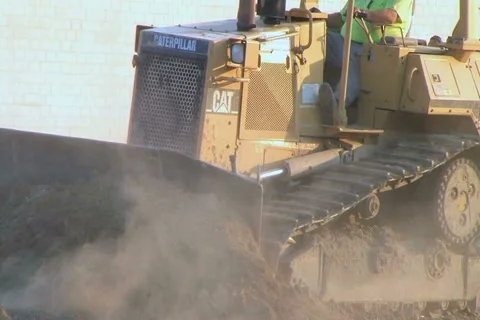 Dozer Clears Edge of Road Stock Footage 2758056