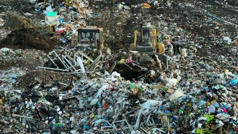 Dozer on Garbage Dump. Landfill with solid household waste, rubbish Stock-Footage 218213949