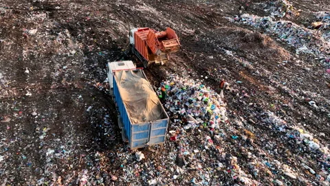 Dozer on Garbage Dump. Landfill with solid household waste, rubbish 動画素材 218215014