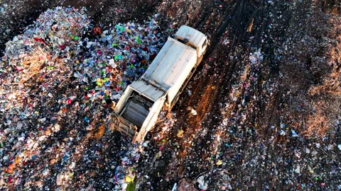 Dozer on Garbage Dump. Landfill with solid household waste, rubbish 動画素材 218215440