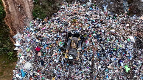 Dozer on Garbage Dump. Landfill with solid household waste, rubbish 動画素材 218233515