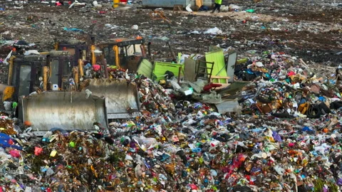 Dozer on Garbage Dump. Landfill with solid household waste, rubbish Stock-Footage 218454229