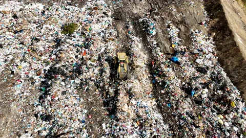 Dozer on Garbage Dump. Landfill with solid household waste Stock Footage 220104418