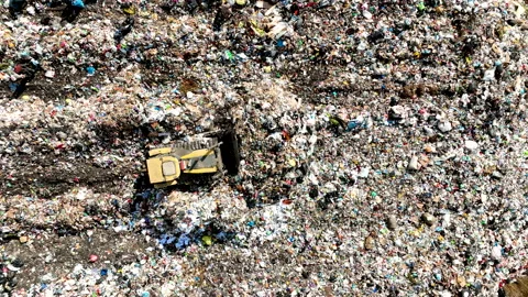 Dozer on Garbage Dump. Landfill with solid household waste Stock Footage 220104431