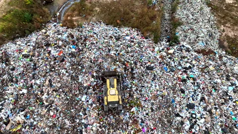 Dozer on Garbage Dump. Landfill with solid household waste Stock Footage 220104831