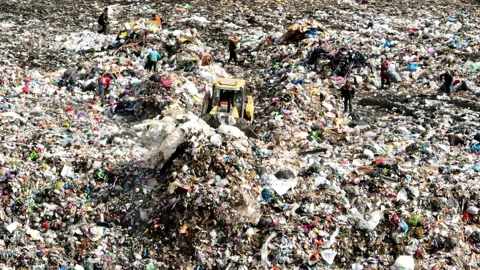 Dozer on Garbage Dump. Landfill with solid household waste Stock Footage 220104863