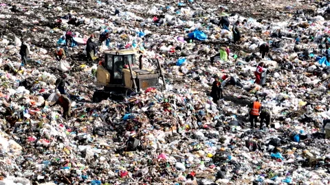 Dozer on Garbage Dump. Landfill with solid household waste Stock Footage 220105161
