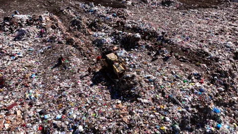 Dozer on Garbage dump with waste plastic and polyethylene. landfill Stock Footage 212014715