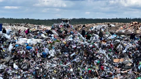 Dozer on landfill. Garbage dump with waste plastic, rubbish and polyethylene. Stock Footage 220105246