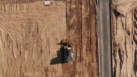 Dozer levelling the ground during road construction, aerial view. 스톡 동영상 201747174